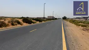 Land for sale in Al Sajaa area, two streets (front 36) and back, directly opposite Al Hanu.
