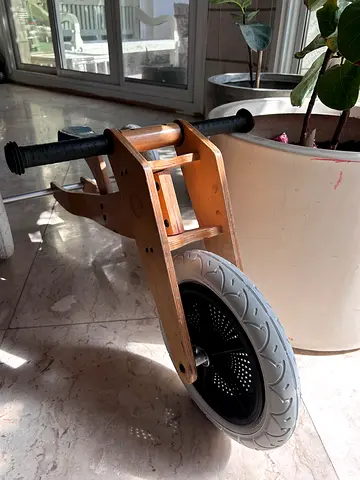 Wooden balance bike / toddler run bike in good condition. Wishbone. Box of spare parts