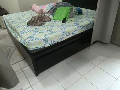 Queen-size wooden bed frame with storage drawers - good condition