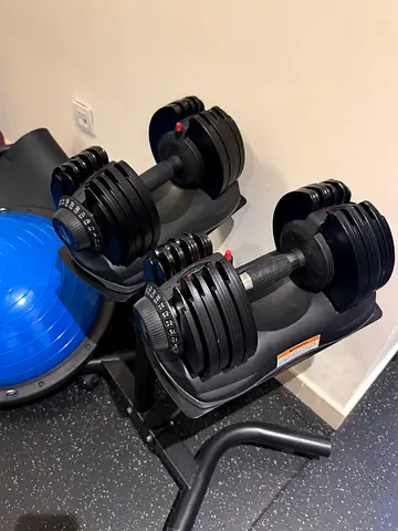 Pair of adjustable dumbbells (Bowflex-style) with stand - good condition