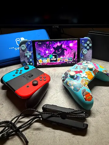 Nintendo Switch OLED Bundle – 60 Games + 512GB SD Card + Pro Controller + Gengar Joy-Cons