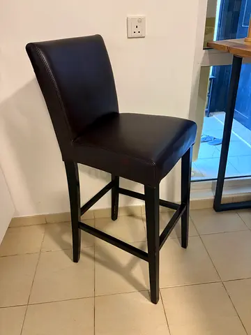 Two Crate and Barrel leather bar stools