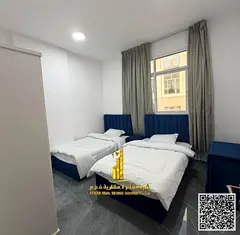 For monthly rent in Ajman, two-bedroom apartment with a balcony open view, fully furnished new with