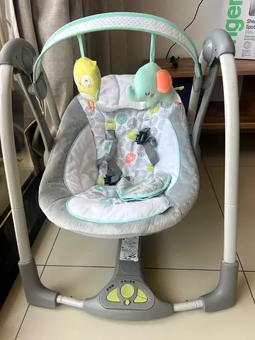 Used baby swing/rocker with toys and harness - good condition