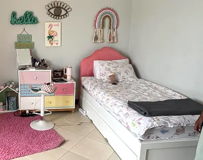 Beautiful single kids bed with pull out bed and pastel dresser - very good condition