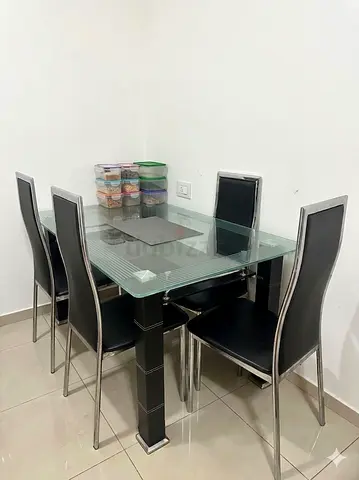 Glass Top Dining Table with 5 Black High-Back Chairs