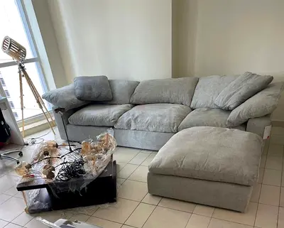 In great condition Pan Emirates Pianca Modern Corner Feather filled sofa with ottoman