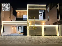 Luxury villa for sale with two floors and a roof, central air conditioning, and a spacious yard, nea
