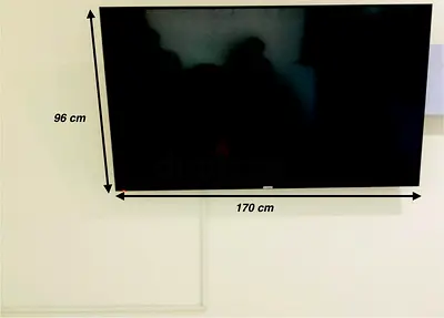 Geepas 75+ Flat Panel TV Wall-Mounted (170 x 96 cm visible) - Good Working Condition