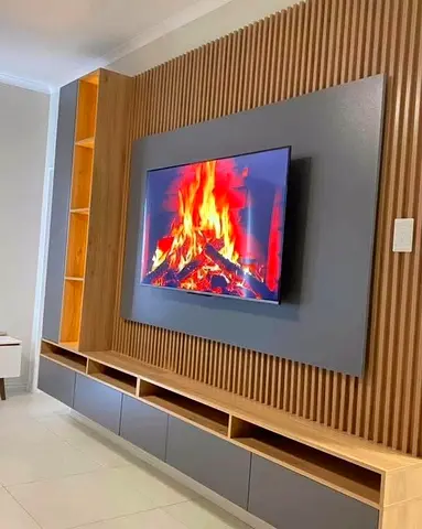 Modern wooden TV entertainment unit with slatted feature wall