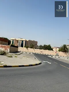 For Sale in Sharjah, Al Tarfa Area Residential Land Corner on three streets, 18 meters wide and 12 m