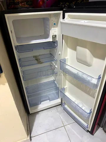 Used single-door refrigerator with freezer compartment - good working condition