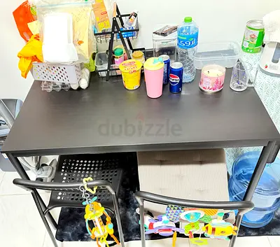 Compact black study/work table with two chairs - good condition