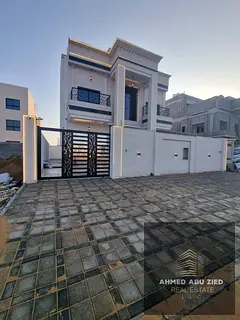 Luxury villa for sale in Al Helio Ajman with modern design, premium finishing, prime location, spaci