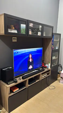 Large modular entertainment center with cabinets and shelves - dark wood