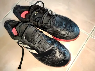Used black football/soccer shoes, size approx. 41