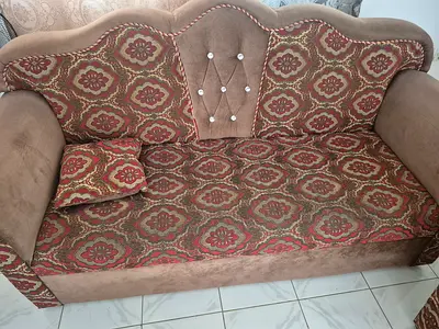 2-seater patterned fabric sofa in good used condition
