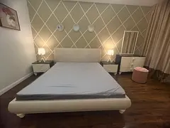 King size upholstered bed with bedside tables and dresser - very good condition including mattress