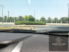 Residential commercial land for sale in Al Yasmeen Ajman, 10000 sqft, G+10, near MBZ Road, prime in