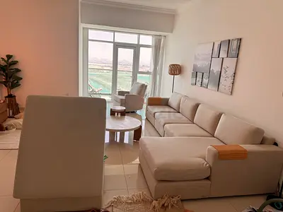 Light Beige L-Shaped Sofa with Ottoman and Accent Chair - Good Condition