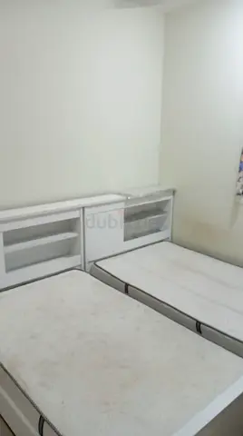 Two single white beds with mattress with headboard storage - used