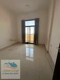 For annual rent: One bedroom, living room, two bathrooms, and balcony in Al Jurf 3, near the Sharja