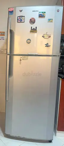 Silver double-door refrigerator, good working condition