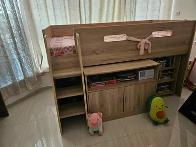 Kids loft bed with built-in shelves and storage cabinet — good condition