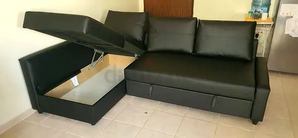 Black L-shape Sofa with Storage and Pull-out Bed - Good Condition