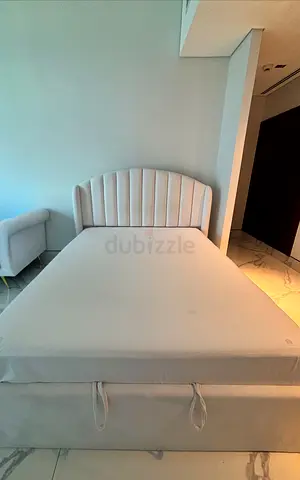 Queen bed with matress and storage room