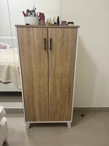 Compact two-door wardrobe / storage cabinet in wood finish