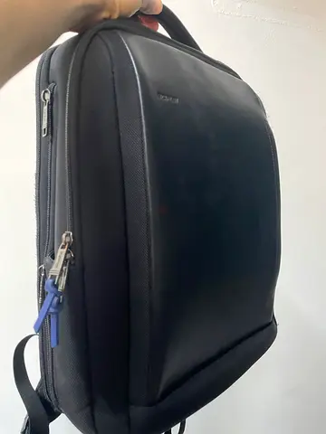Slim black backpack — good condition, roomy back compartment