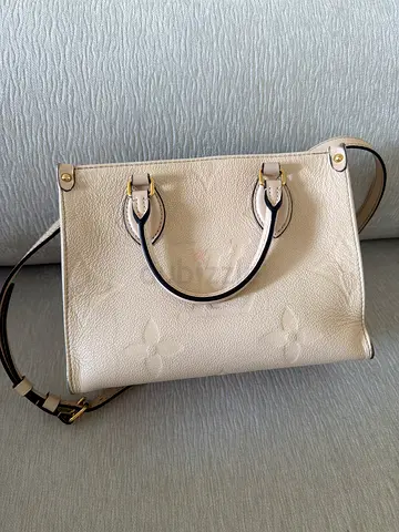 Louis Vuitton On The Go bag, White embossed leather tote bag with crossbody strap - gently used