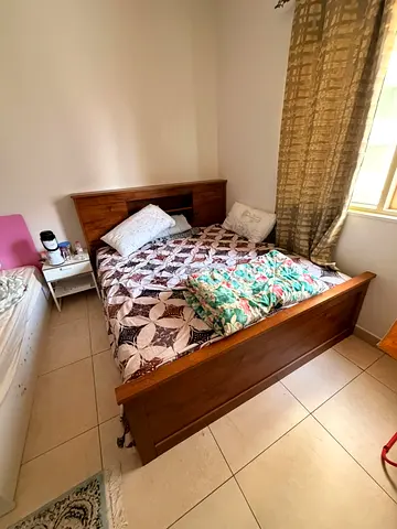 Solid Wood Double Bed with Headboard and Storage Shelves - Good Condition