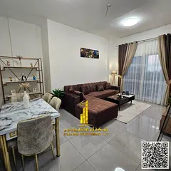 Luxury two-bedroom apartment with a living room and balcony. Ajman, Al Rashidiya 3. Fully furnished.