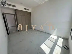 First-tenant 1BR apartment in Al Alia, Ajman. Free month, balcony, central AC, 2 baths, wardrobes,