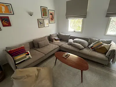 Light grey L-shaped sectional sofa — comfortable, great condition.