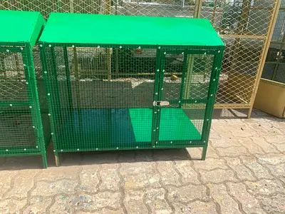 Green outdoor rabbit/rodent hutch — sturdy metal mesh enclosure