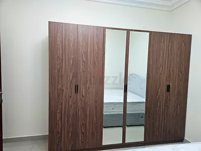 Large 6- Door Wooden Wardrobe with Mirrored Center Panels - Not Used | Urgent | Muwaileh Commercial