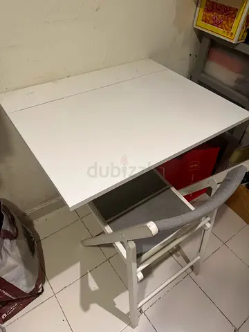 two wall attached table and chair