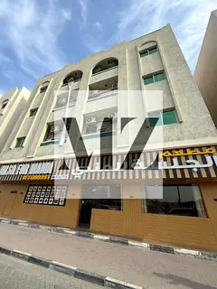 For sale: A building in Sharjah, in the Muwaileh area, on a main street. Building area: 6,000 sq ft.