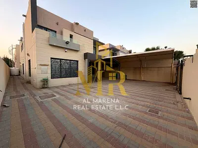 For sale: Residential/commercial villa in Al Muwaihat 1, Ajman. Price includes electricity, water, air conditioning, and furnishings. Located near She