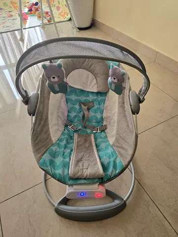 Lightweight Baby Swing/Rocker with Toy Bar — Good Condition. Price negotiable.