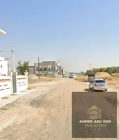 Residential investment land for sale in Al Helio 2 Ajman, G+2 permit, prime location opposite servi