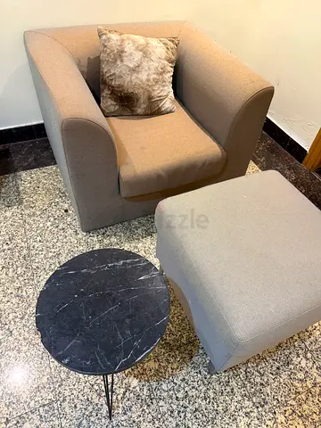 Single armchair with ottoman and small marble-top side table - grey