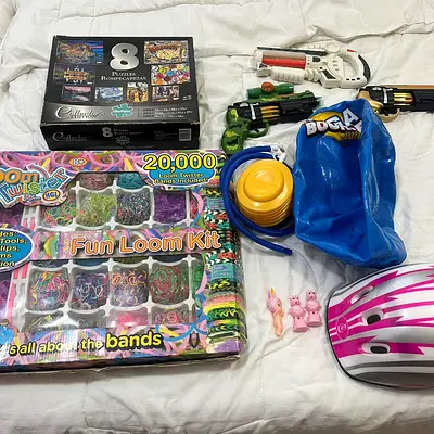 Mixed kids toys lot: Fun Loom Kit, 100 piece puzzles, mega bounce ball, blaster, helmet  more