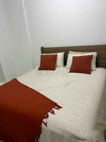 King bed with headboard, mattress and bedding set - good condition. Total value of AED 2500 +