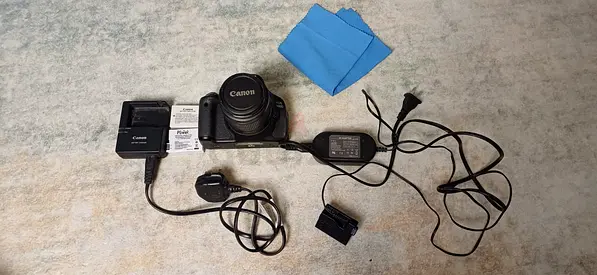 Canon DSLR with charger, battery and accessories - used