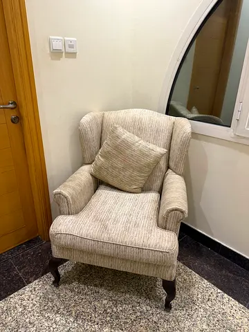 Beige Upholstered Wingback Armchair with Cushion - Good Condition