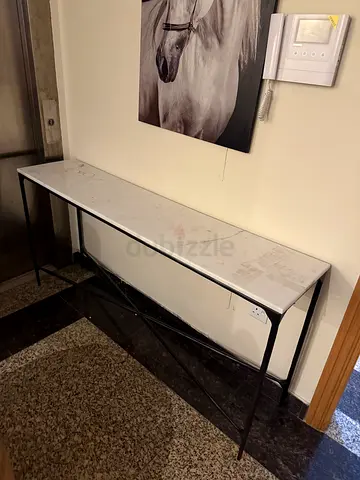 Slim marble-top console table with black metal legs